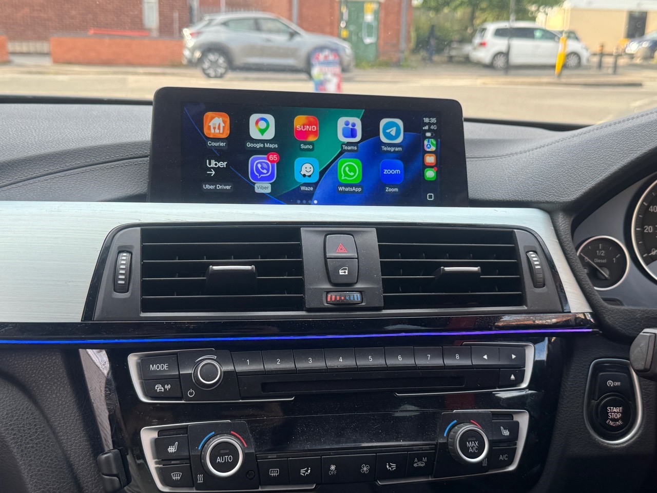 BMW dashboard with CarPlay active after OEM Motion activation