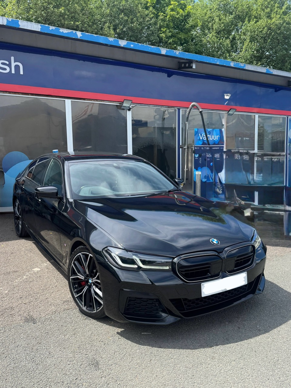 BMW 530d G30 exterior with registration hidden before coding work
