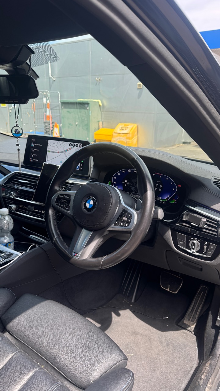 BMW 530d G30 interior with iDrive and cluster context