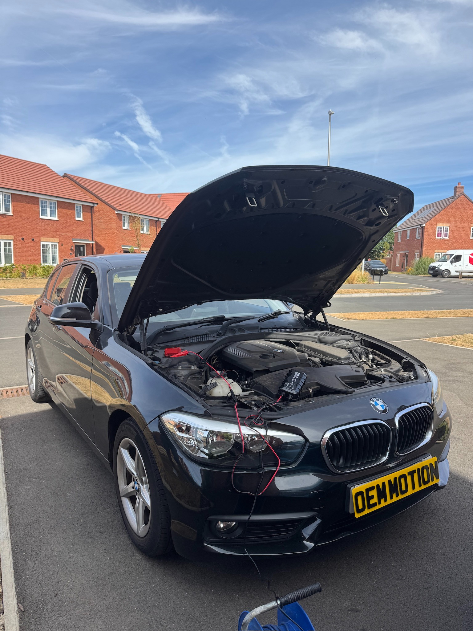 2016 BMW F20 116d undergoing an EntryNav head-unit software update by OEM Motion
