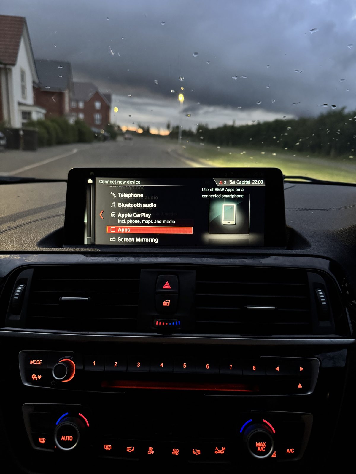 BMW M140i iDrive menu showing Apple CarPlay option
